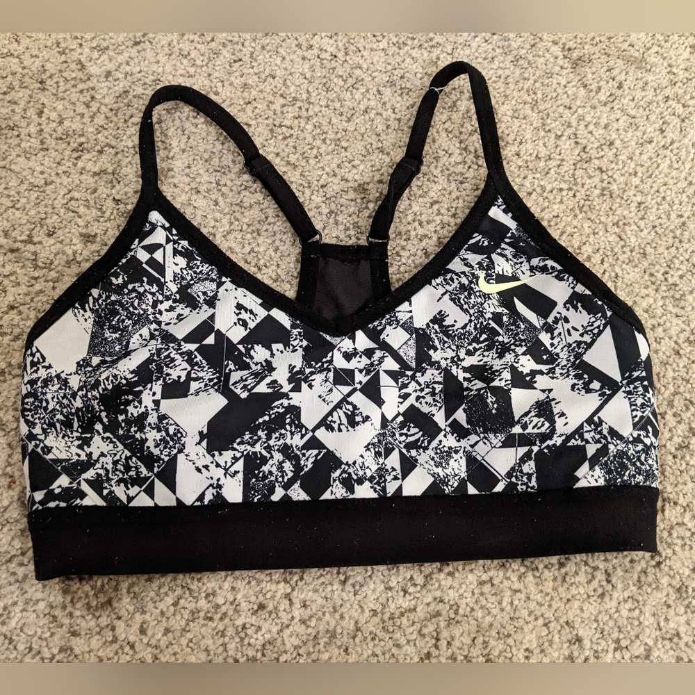 Nike sports bra black white geometric pattern mesh back yellow logo